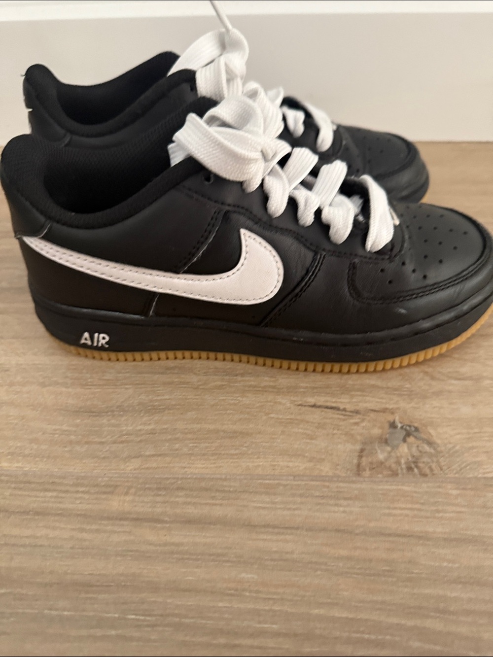 Nike Air Force1 Kids Black Leather Low-Top Sneakers with White Swoosh